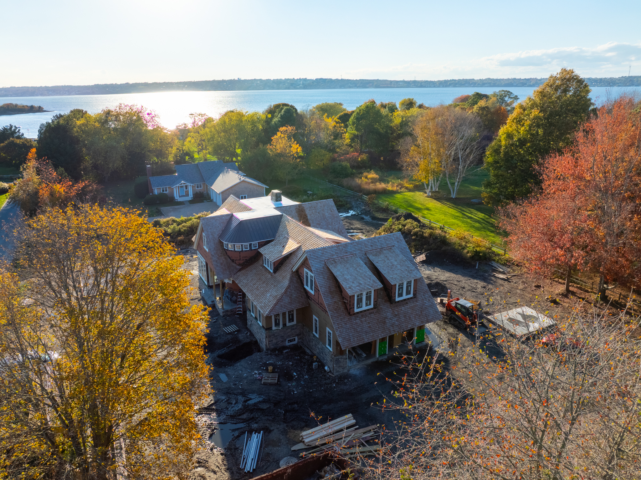Drone photo of a waterfront home under construction in autumn