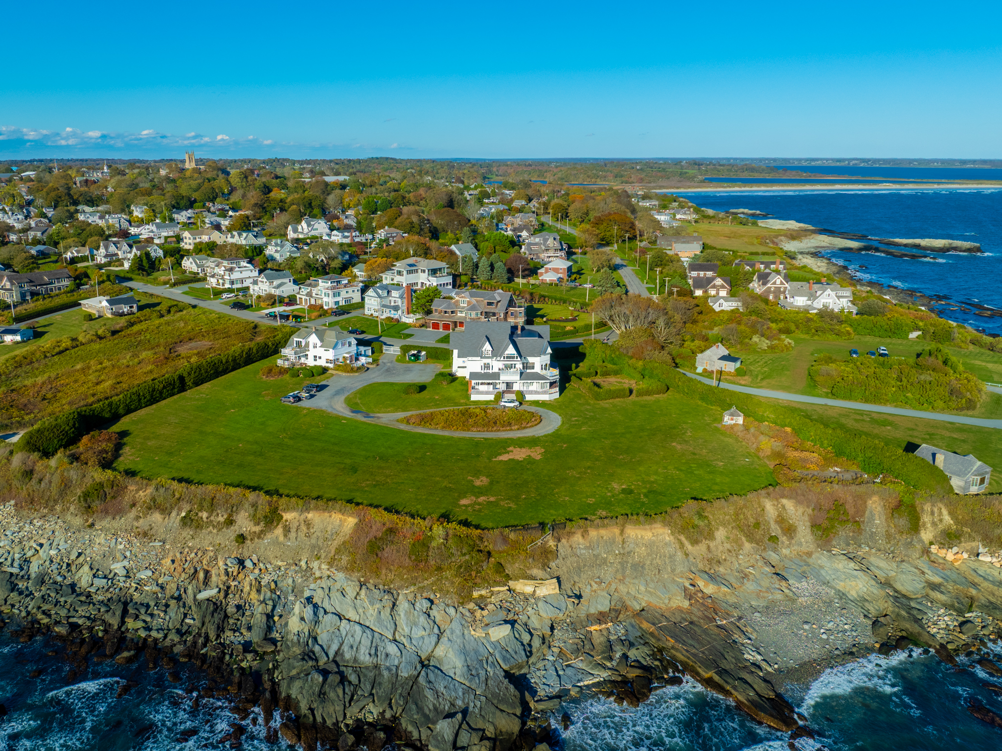 Drone photo of a cliff-side estate in Newport Rhode Island overlooking the ocean